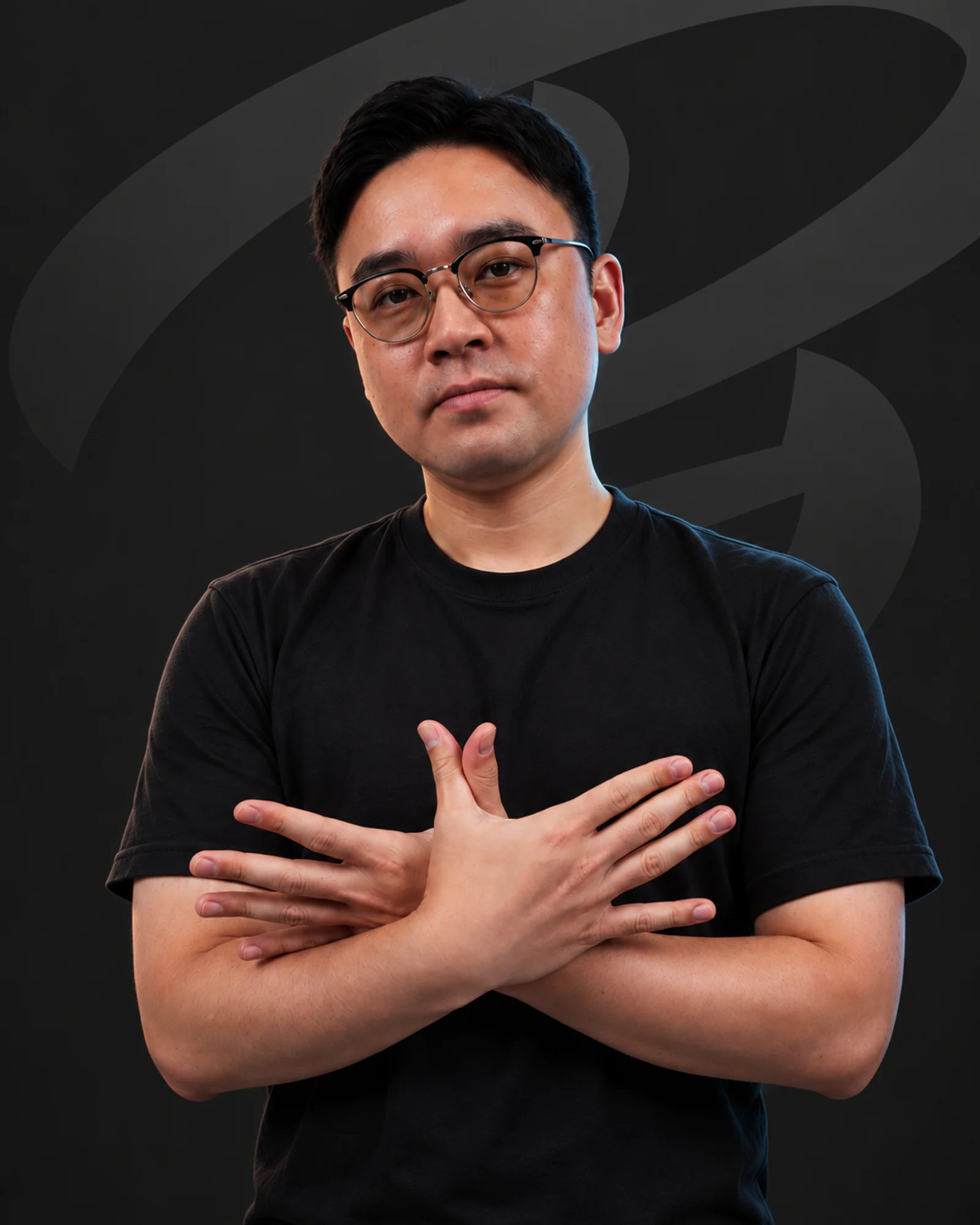 NL wearing a black T-shirt against the Bandits portrait background
